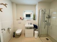 Badezimmer-mit-Strauss-und-Dusche